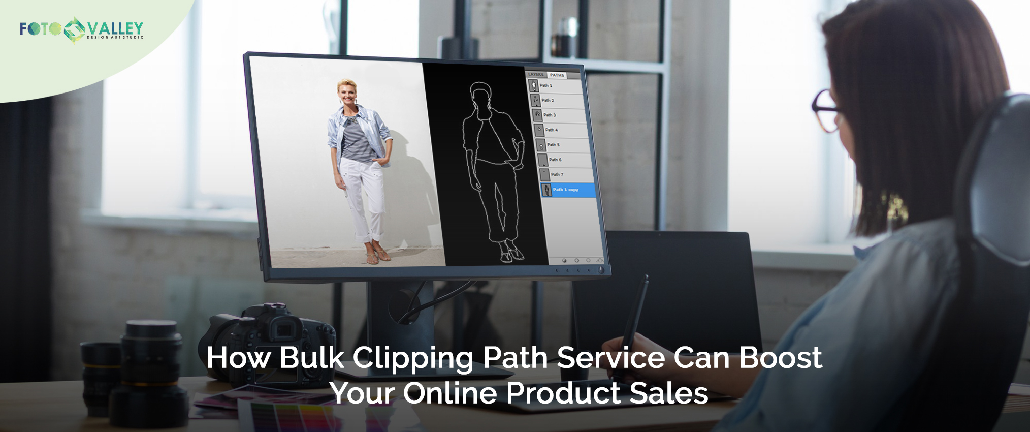 A woman meticulously working on an image, demonstrating the precision of bulk clipping path service.