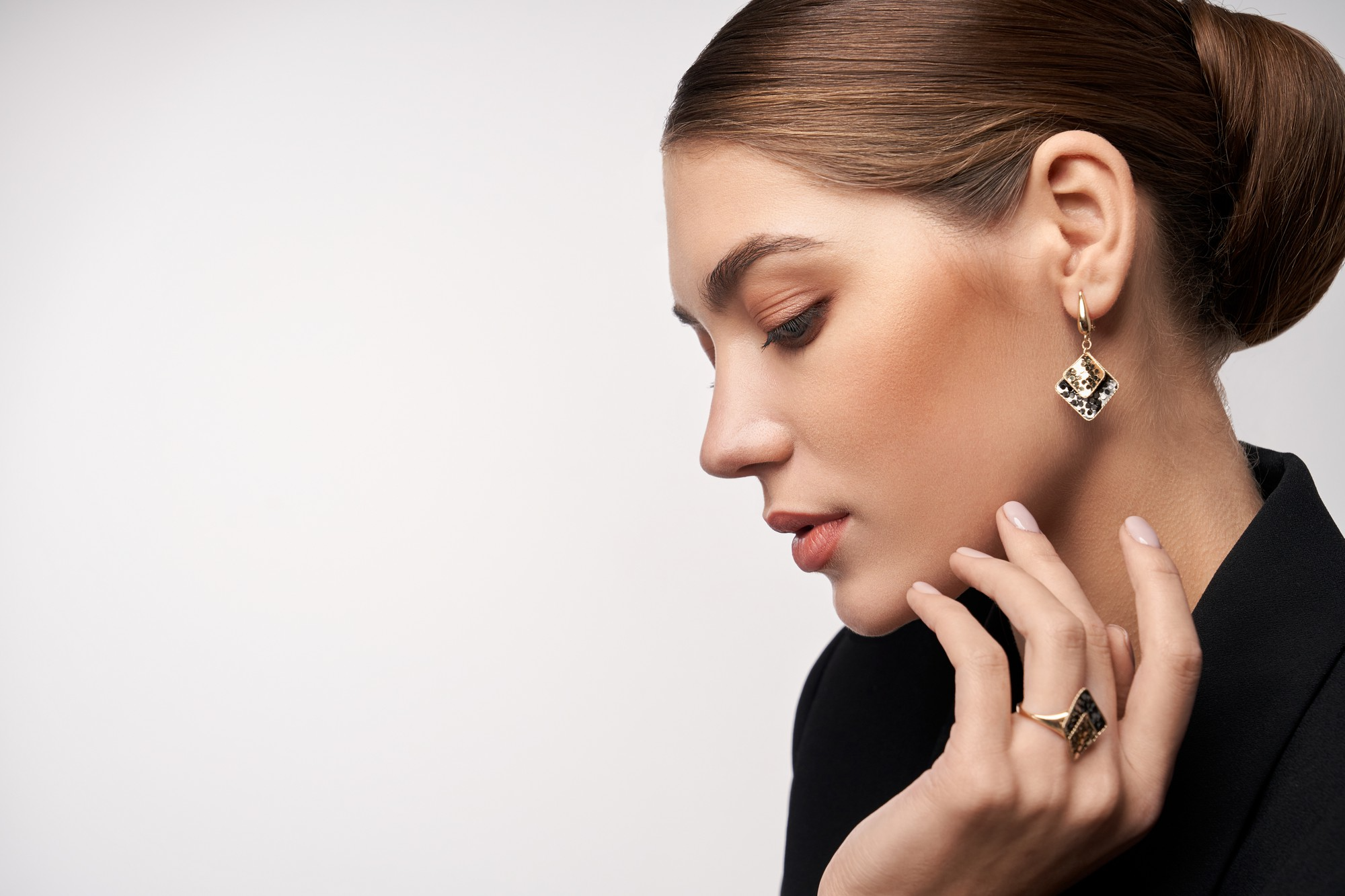 Close-up of a woman wearing professionally retouched jewelry.